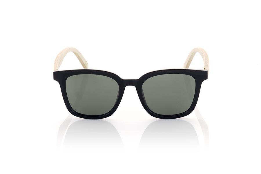 Wood eyewear of Maple MALM. MALM sunglasses are an ideal option for those looking for a modern and daring design with a touch of originality. Its completely straight and flat frame in satin black gives it a modern and elegant look. With rounded shapes and a marked brow, these glasses are suitable for both men and women. The very light maple wood temples add an interesting contrast and a natural touch to the design. In addition, these glasses are available with clear flat lenses in various colors, such as yellow, blue, pink and khaki green, allowing you to customize your look and adapt it to your personal style. Without a doubt, MALM sunglasses are a perfect choice for those looking for a combination of modern design and marked style. for Wholesale & Retail | Root Sunglasses® 